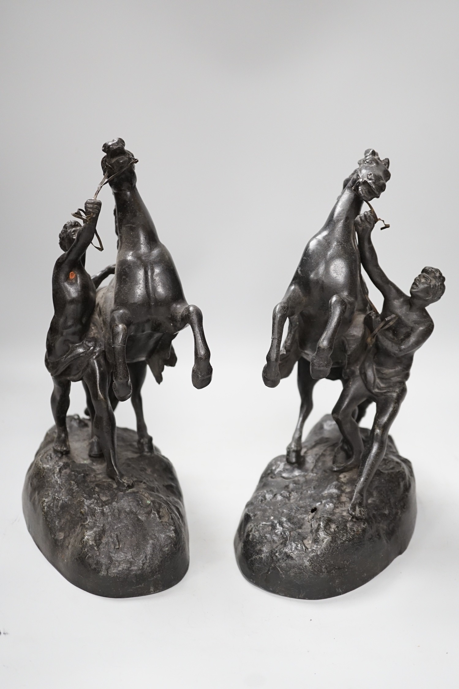 A pair of spelter Marley horses, 31cm